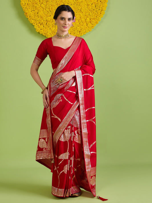 Woman wearing red silk blend saree with all-over floral design and red blouse