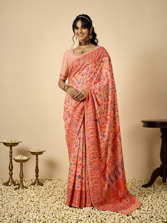 Woman wearing peach cotton silk saree with all-over floral design and peach blouse