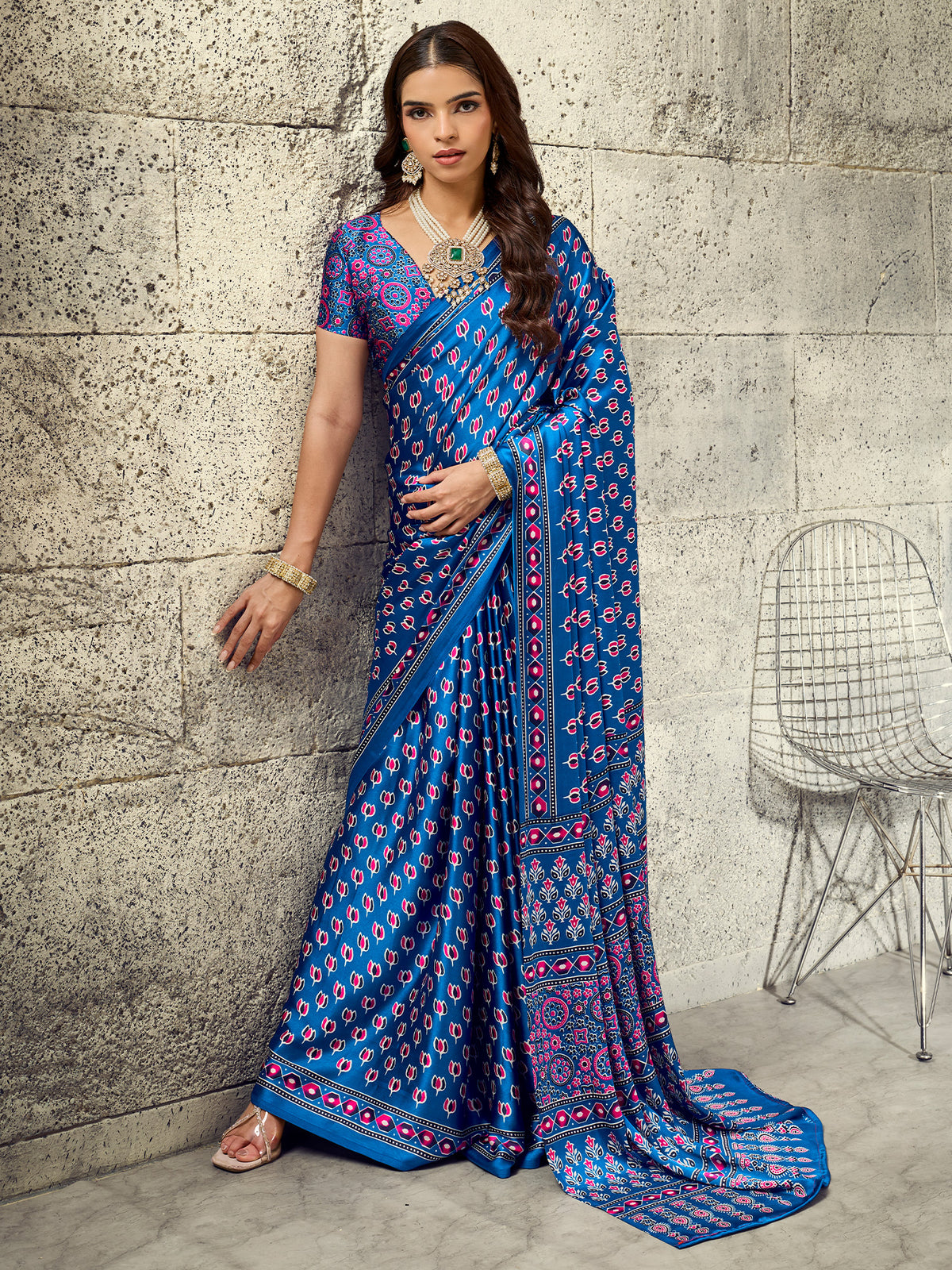 Woman wearing blue satin saree with ajrak block-print motif work and blue blouse
