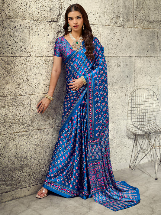 Woman wearing blue satin saree with ajrak block-print motif work and blue blouse