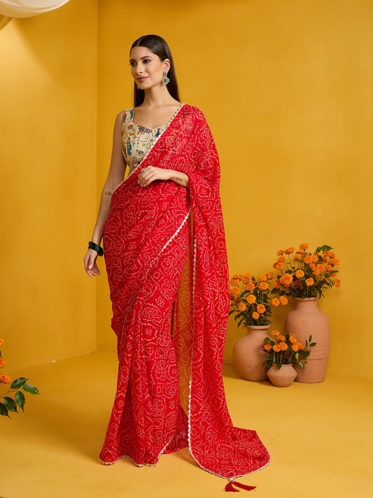 Woman wearing red organza saree with bandhani tie-dye dot work and beige blouse