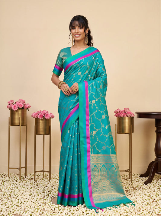 Woman wearing teal blue pure silk saree with traditional indian motif work and teal blue blouse