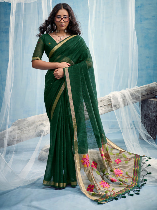 Woman wearing green muga silk saree with clean solid-tone finish and green blouse