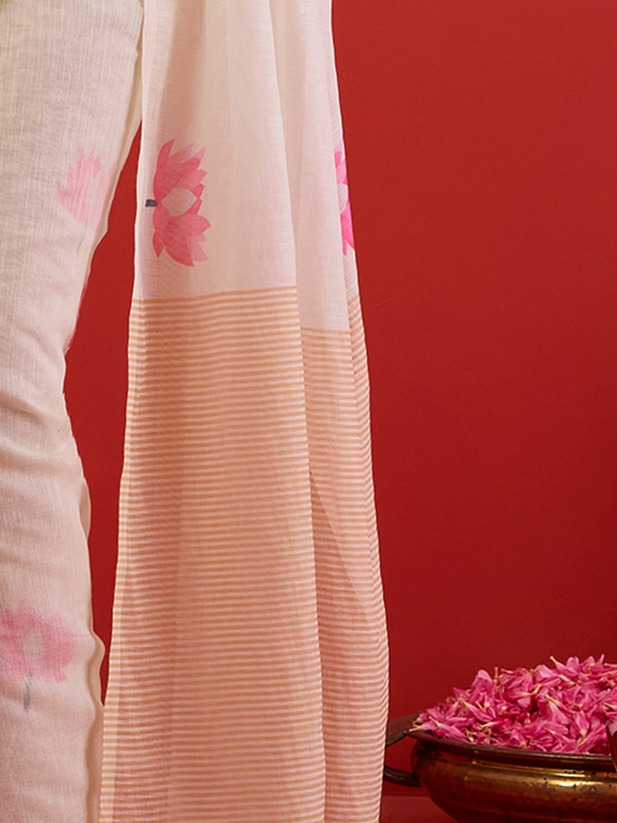 Pallu detail of white chanderi cotton saree showing all-over floral design and woven design border