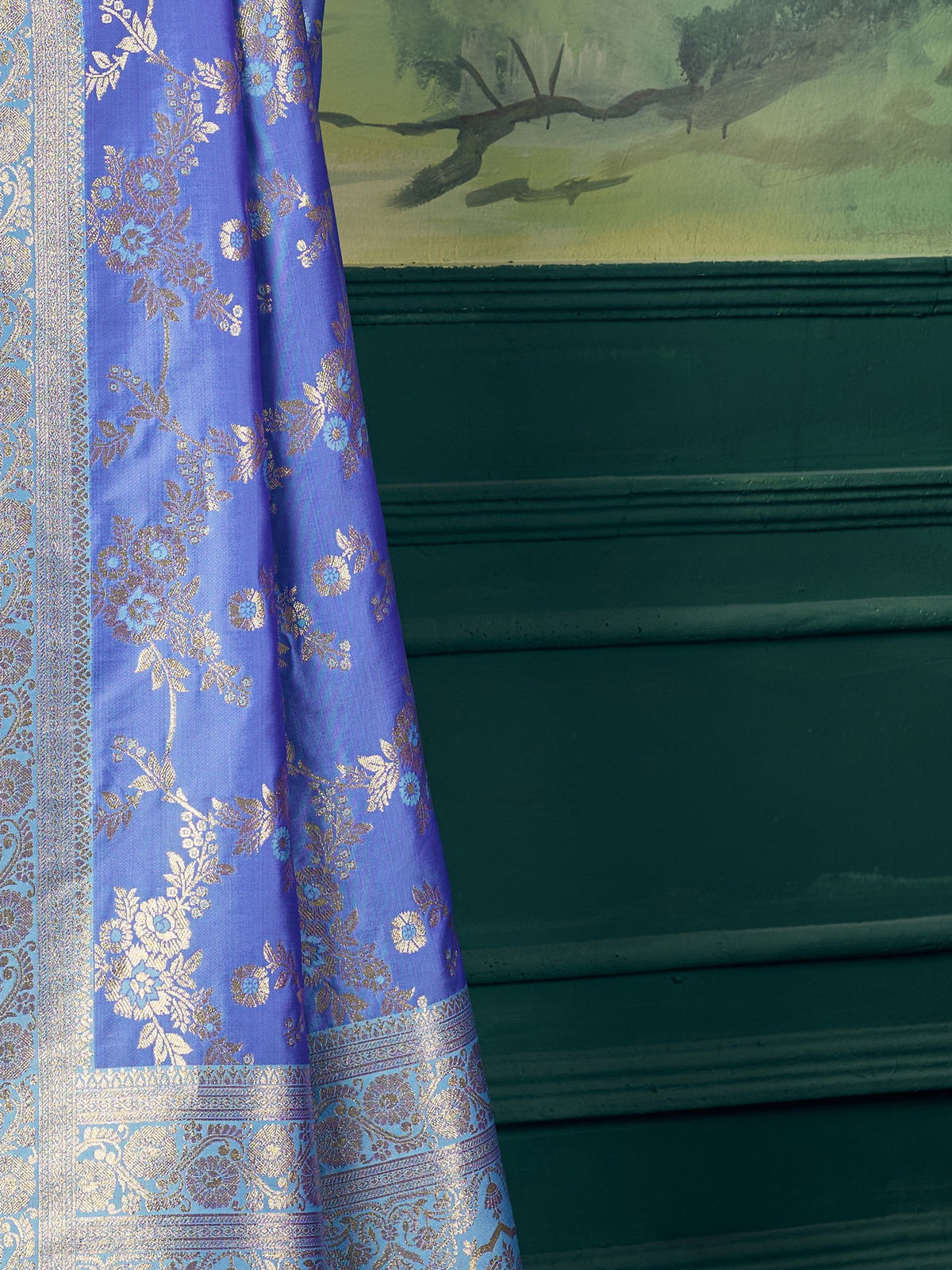 Pallu detail of blue banarasi silk saree showing woven motif design and zari border