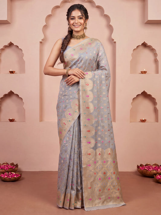 Woman wearing grey silk blend saree with zari butta (metallic motif) work and grey blouse