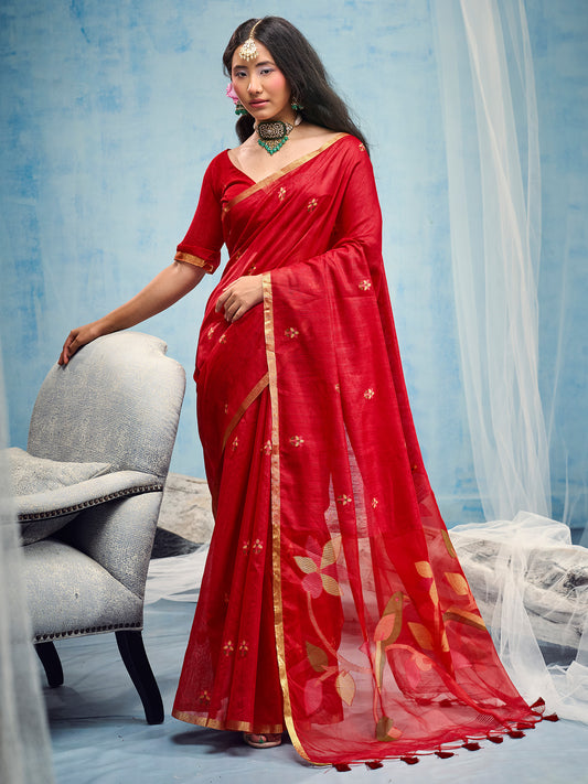 Woman wearing red muga cotton saree with embroidered motif work and red blouse