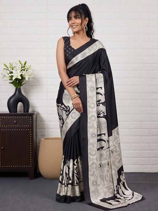 Woman wearing black satin saree with kalamkari narrative motif work and black blouse