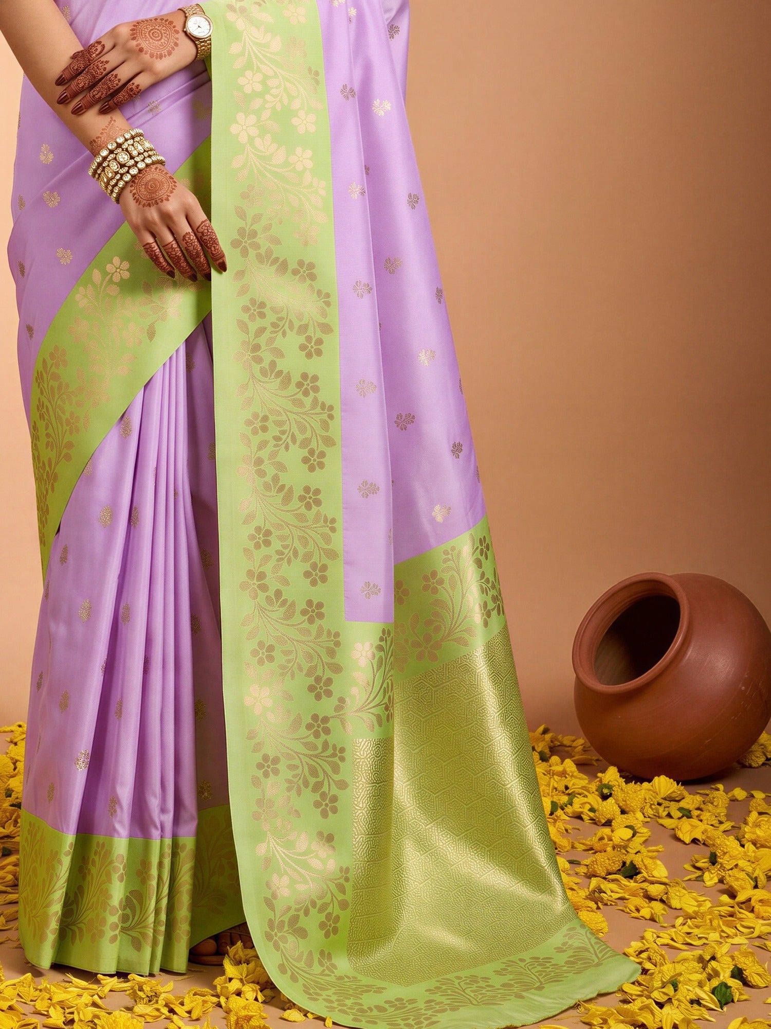 Pallu detail of purple cotton blend saree showing all-over floral design and zari border