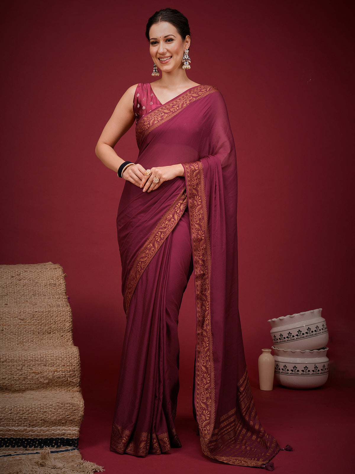 Woman wearing magenta mysore silk saree with clean solid-tone finish and magenta blouse