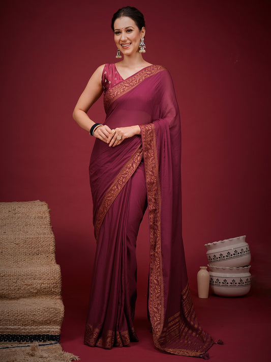 Woman wearing magenta mysore silk saree with clean solid-tone finish and magenta blouse