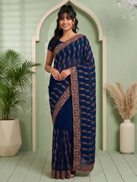 Woman wearing teal blue pure georgette saree with geometric pattern design and teal blue blouse