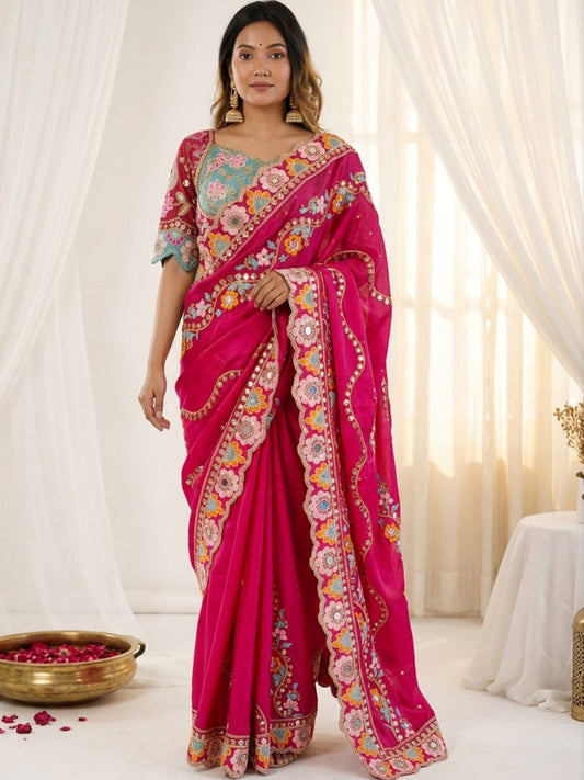 Woman wearing pink pure georgette saree with all-over floral design and pink blouse