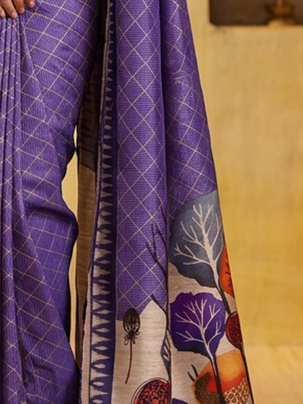 Pallu detail of purple soft silk saree showing geometric pattern design and printed border
