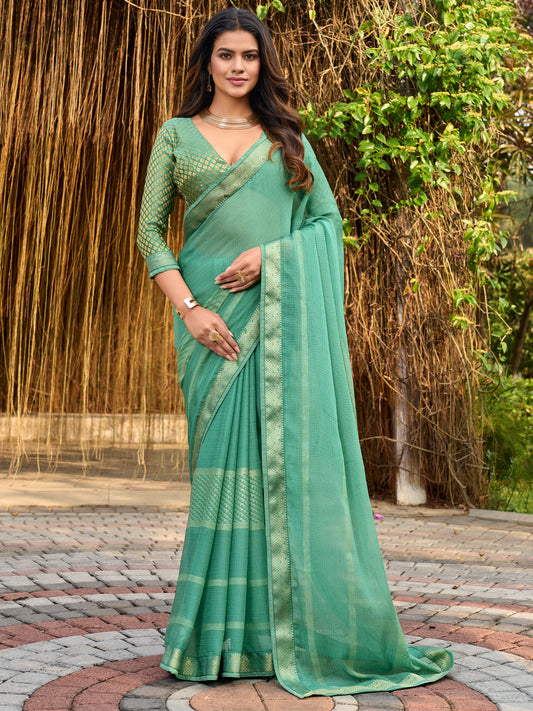Woman wearing mint green chiffon saree with metallic foil print work and mint green blouse