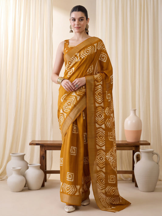 Woman wearing mustard silk blend saree with traditional indian motif work and mustard blouse