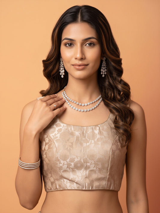 Cream woven brocade silk blend sleeveless readymade saree blouse with round neck