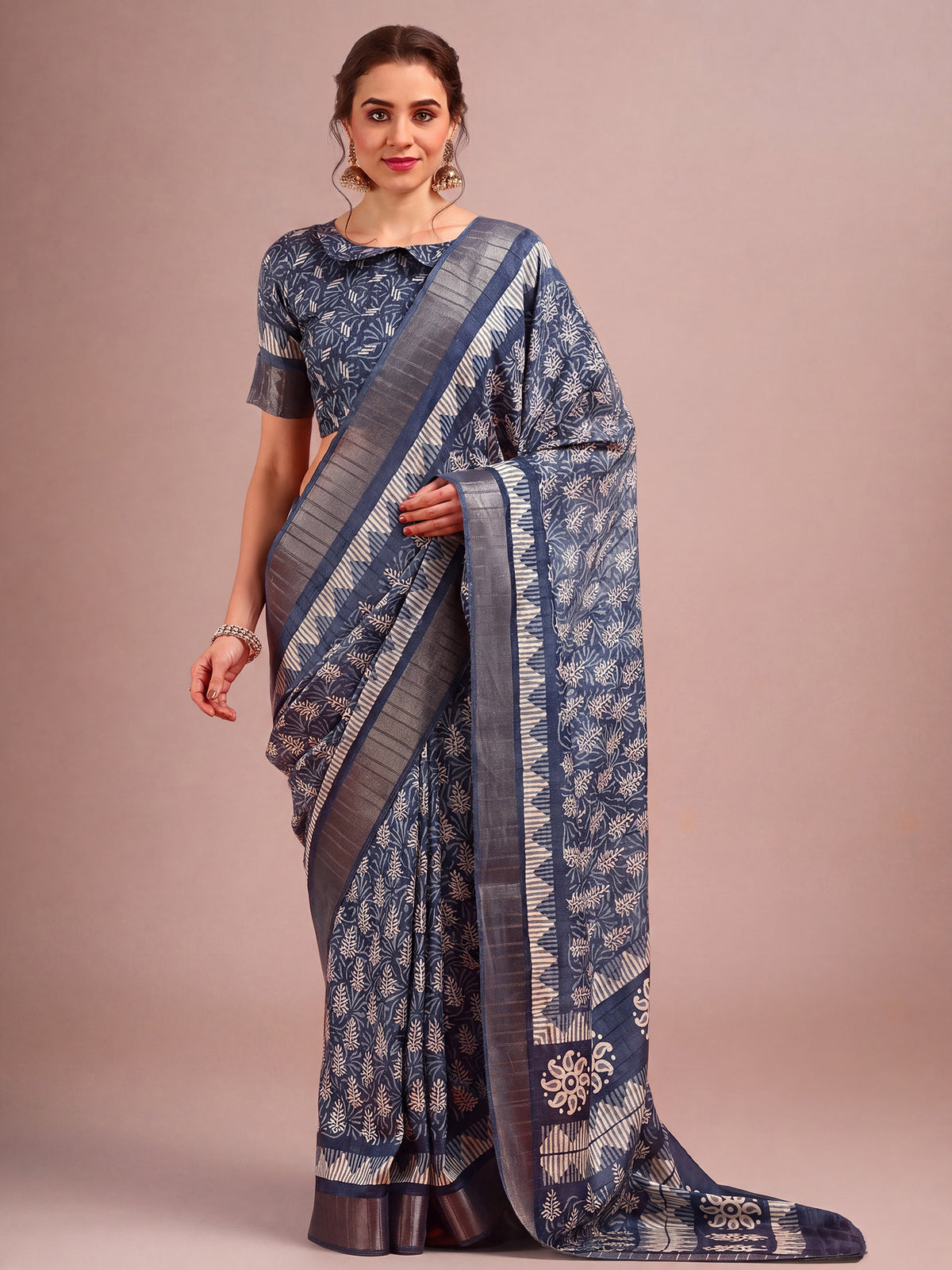 Woman wearing navy blue cotton silk saree with traditional indian motif work and navy blue blouse
