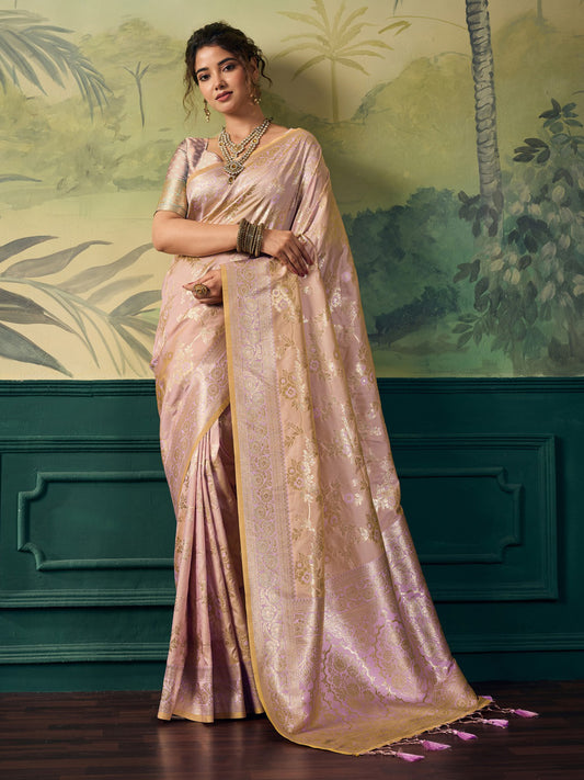 Woman wearing rose gold banarasi silk saree with woven motif design and rose gold blouse