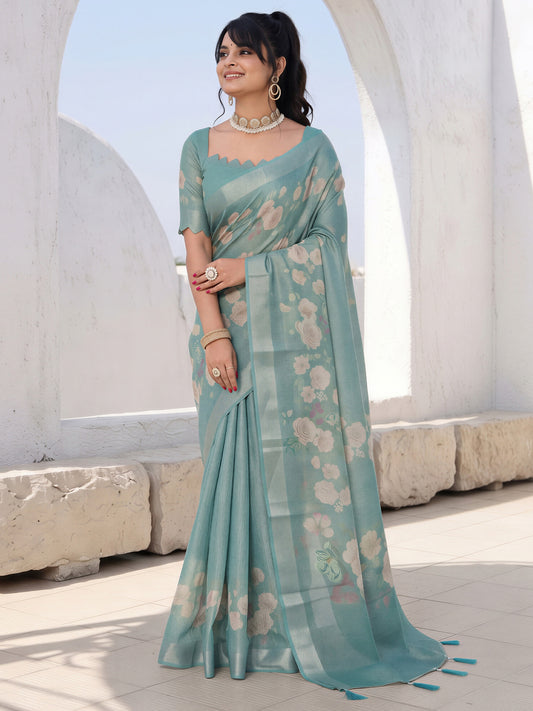 Woman wearing light blue cotton silk saree with all-over floral design and light blue blouse