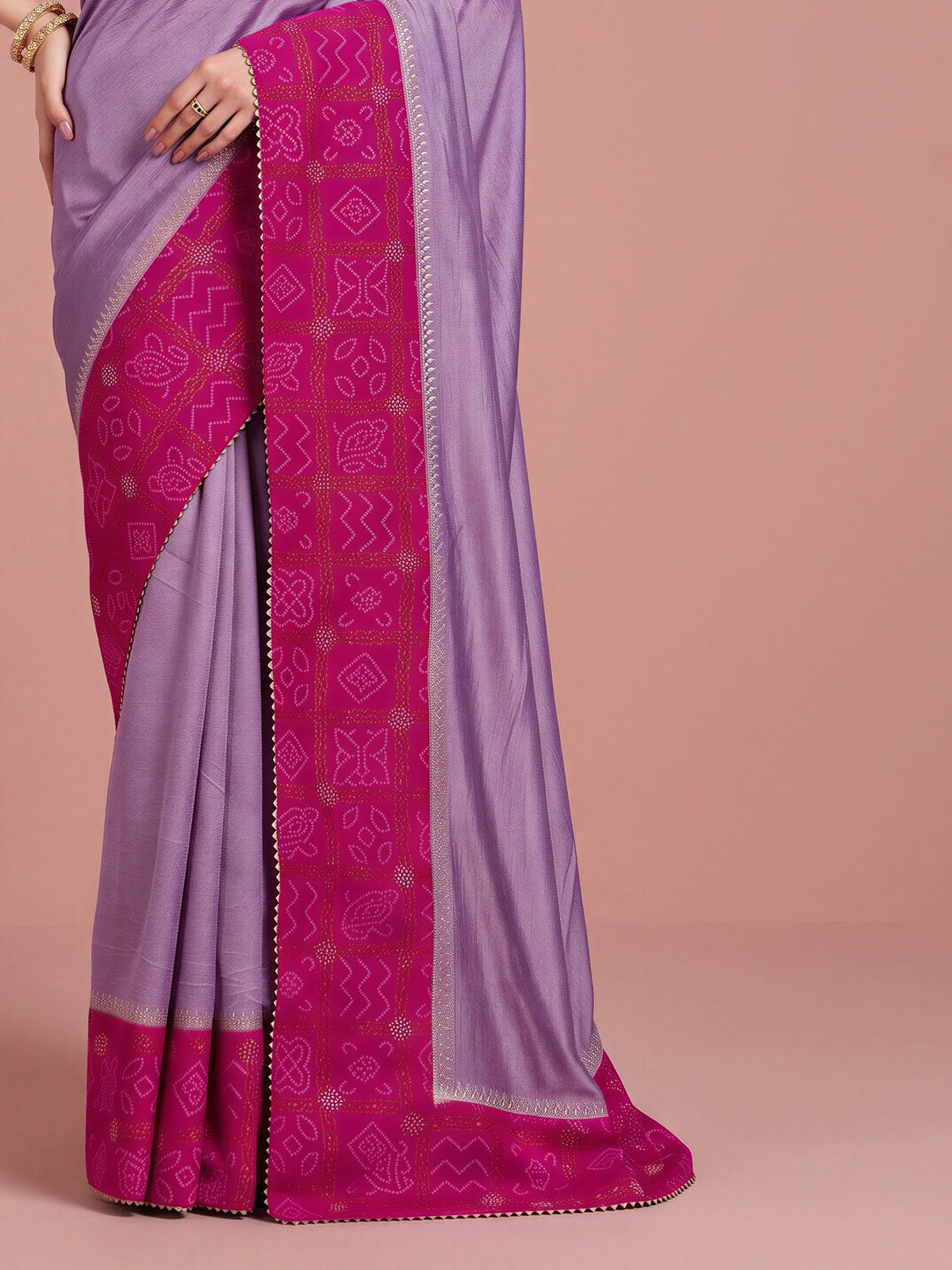 Pallu detail of lavender vichitra silk saree showing bandhani tie-dye dot work and embellished border