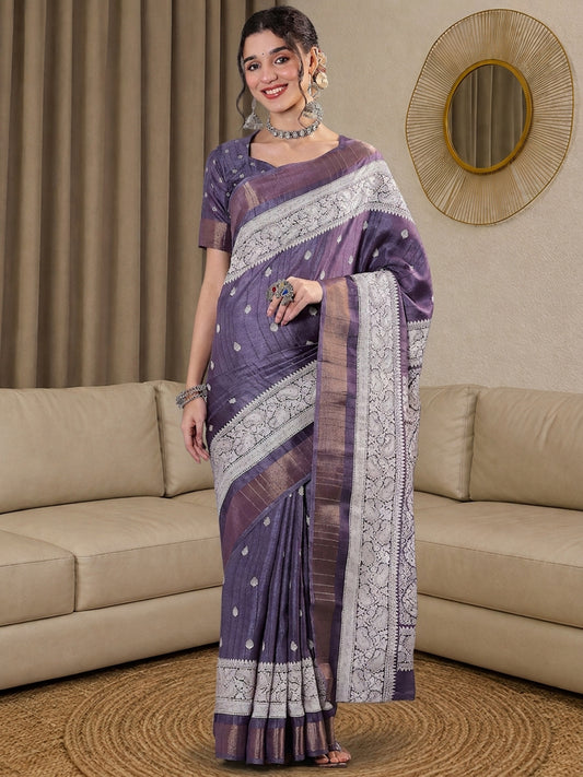 Woman wearing lavender silk blend saree with traditional indian motif work and lavender blouse
