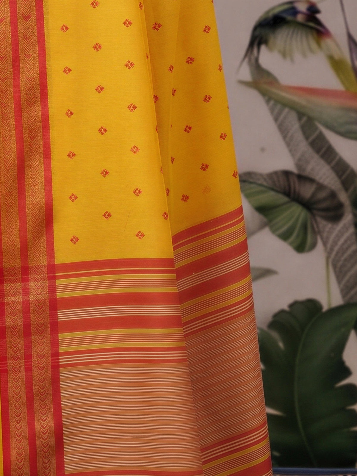 Pallu detail of mustard cotton blend saree showing woven motif design and zari border