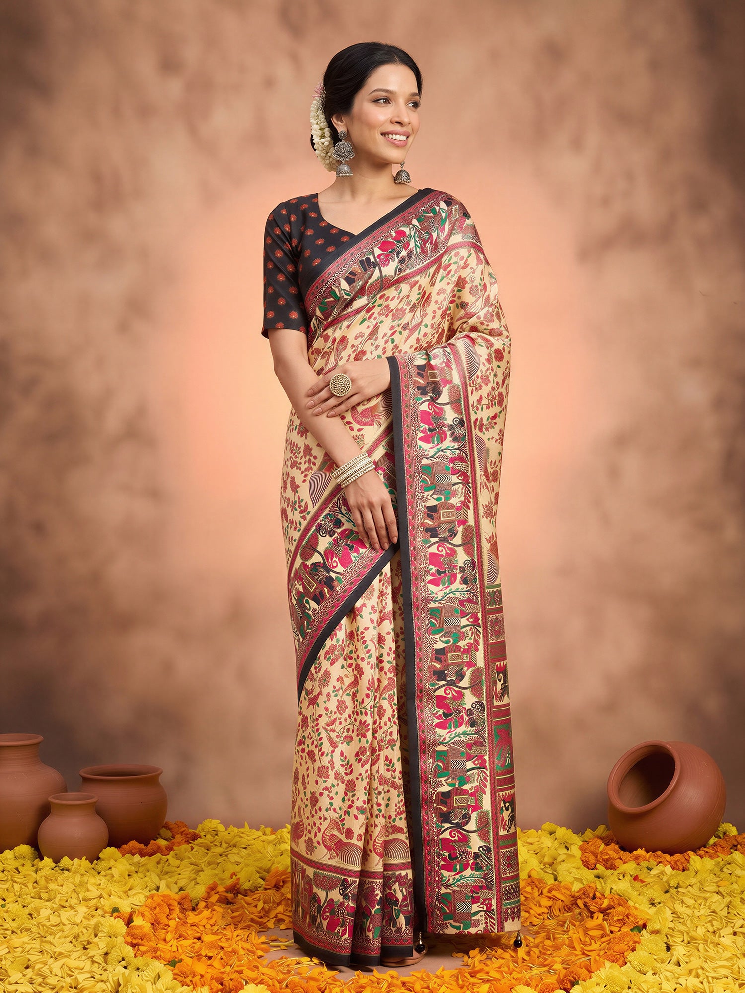 Woman wearing beige silk blend saree with metallic foil print work and black blouse