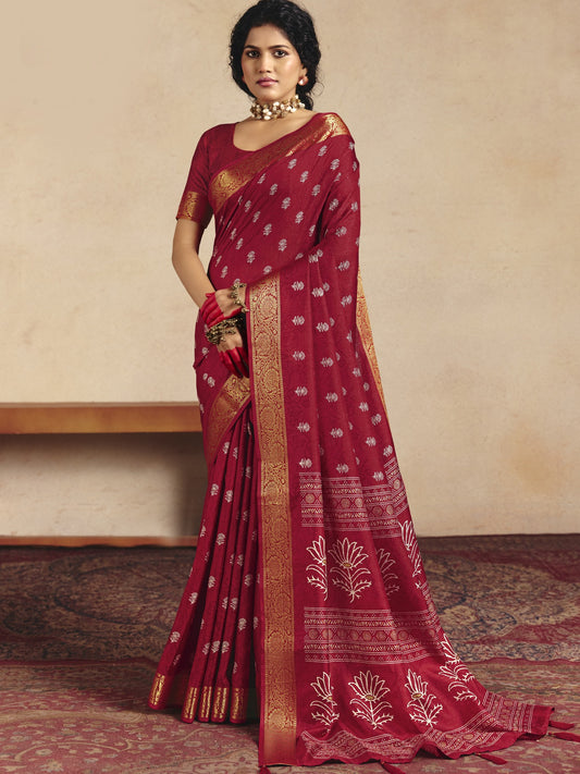 Woman wearing red tussar silk saree with traditional indian motif work and red blouse
