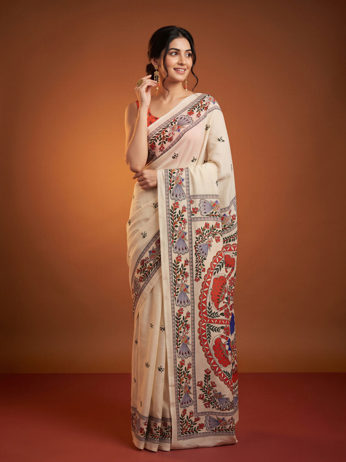 Woman wearing off white chinnon saree with kalamkari narrative motif work and coral blouse