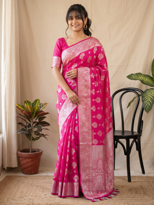 Woman wearing pink georgette saree with all-over floral design and pink blouse