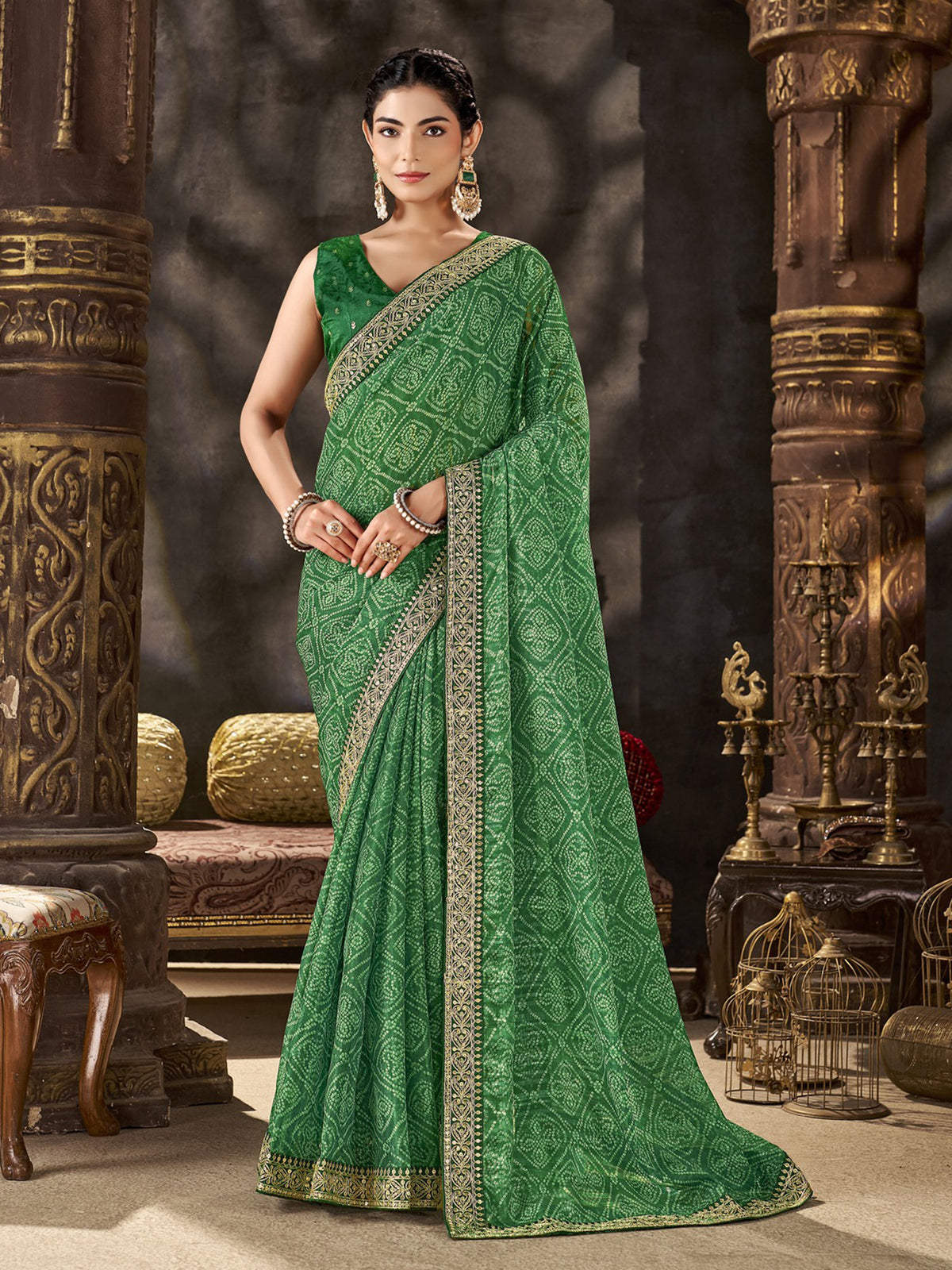 Woman wearing green chiffon saree with bandhani tie-dye dot work and green blouse