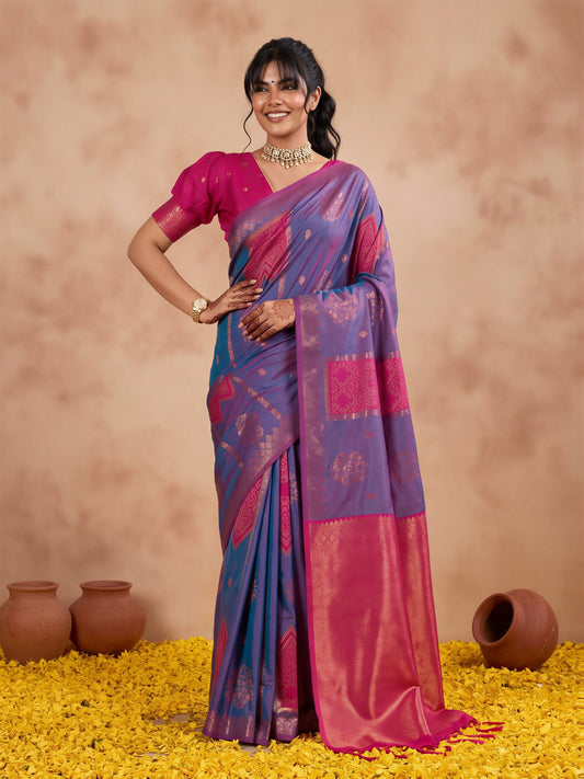 Woman wearing blue silk saree with traditional indian motif work and pink blouse