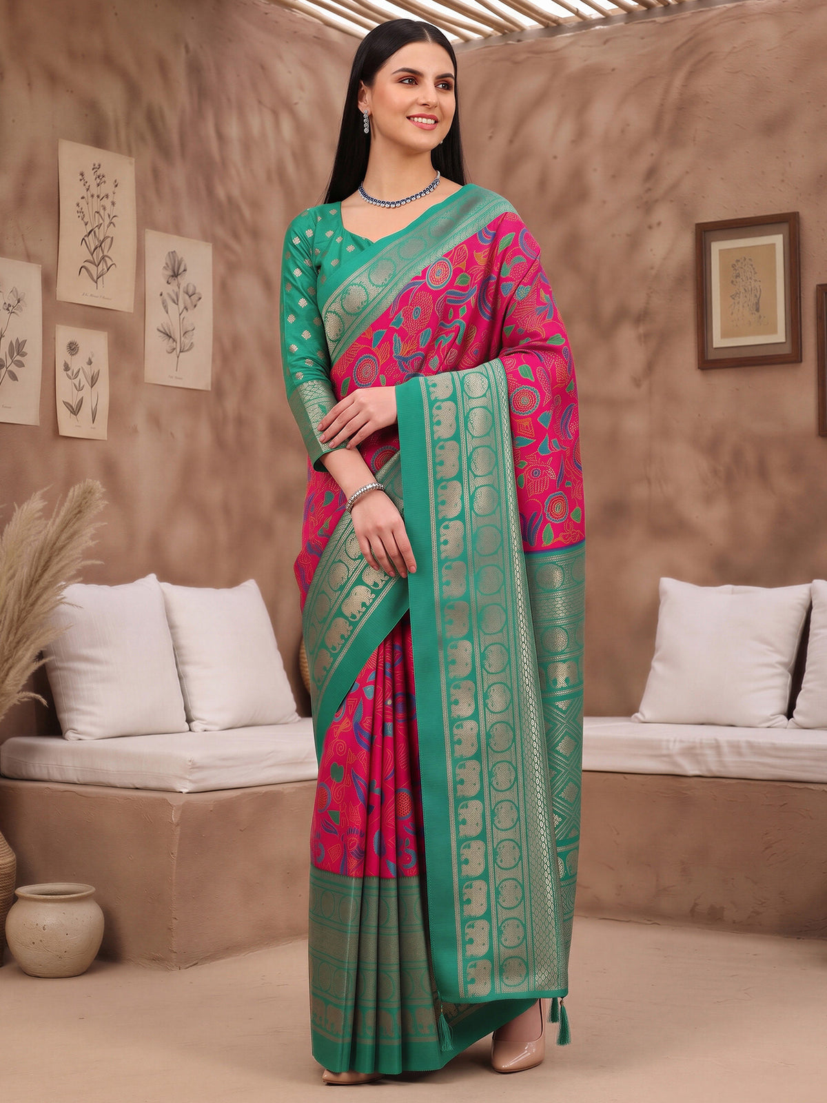 Woman wearing pink cotton blend saree with botanical floral and leaf design and teal blue blouse