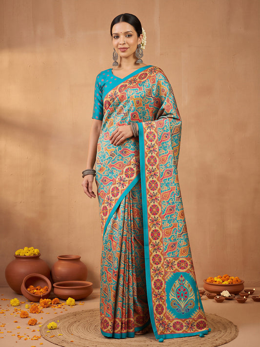 Woman wearing assorted silk blend saree with metallic foil print work and teal blue blouse
