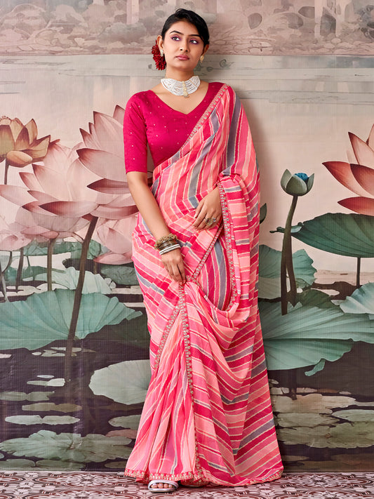 Woman wearing pink georgette saree with leheriya design and pink blouse