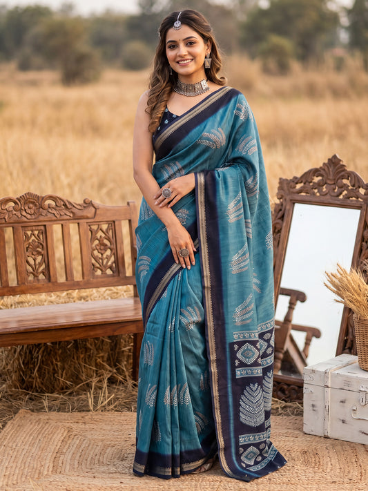 Woman wearing light blue tussar silk saree with hand block-printed motifs and navy blue blouse