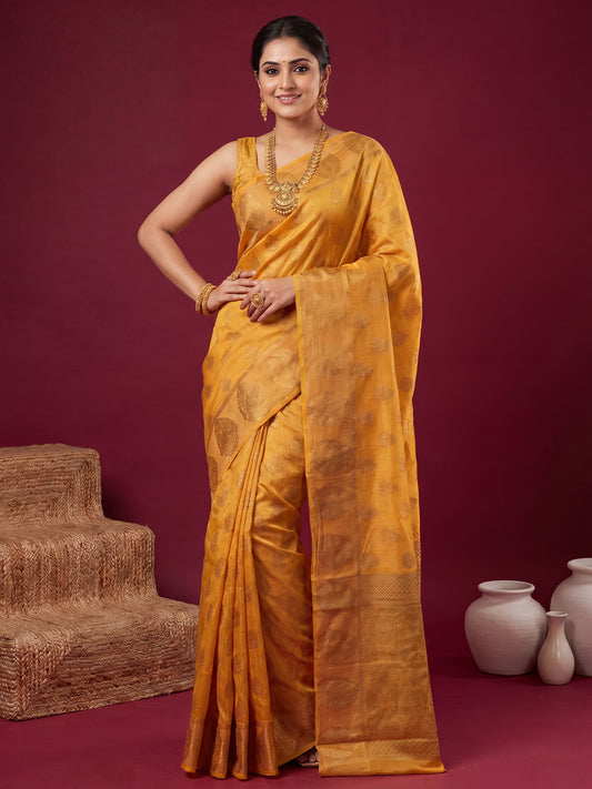 Woman wearing mustard silk blend saree with zari butta (metallic motif) work and mustard blouse