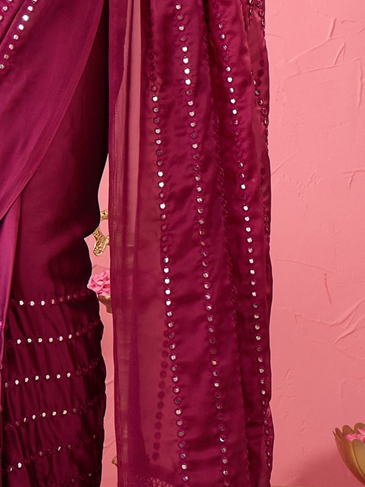 Pallu detail of magenta georgette saree showing ornamented surface design