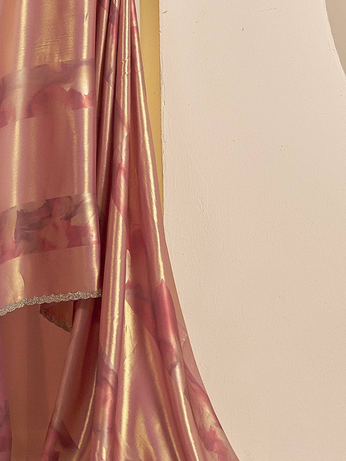 Pallu detail of lavender satin silk saree showing ornamented surface design and embellished border