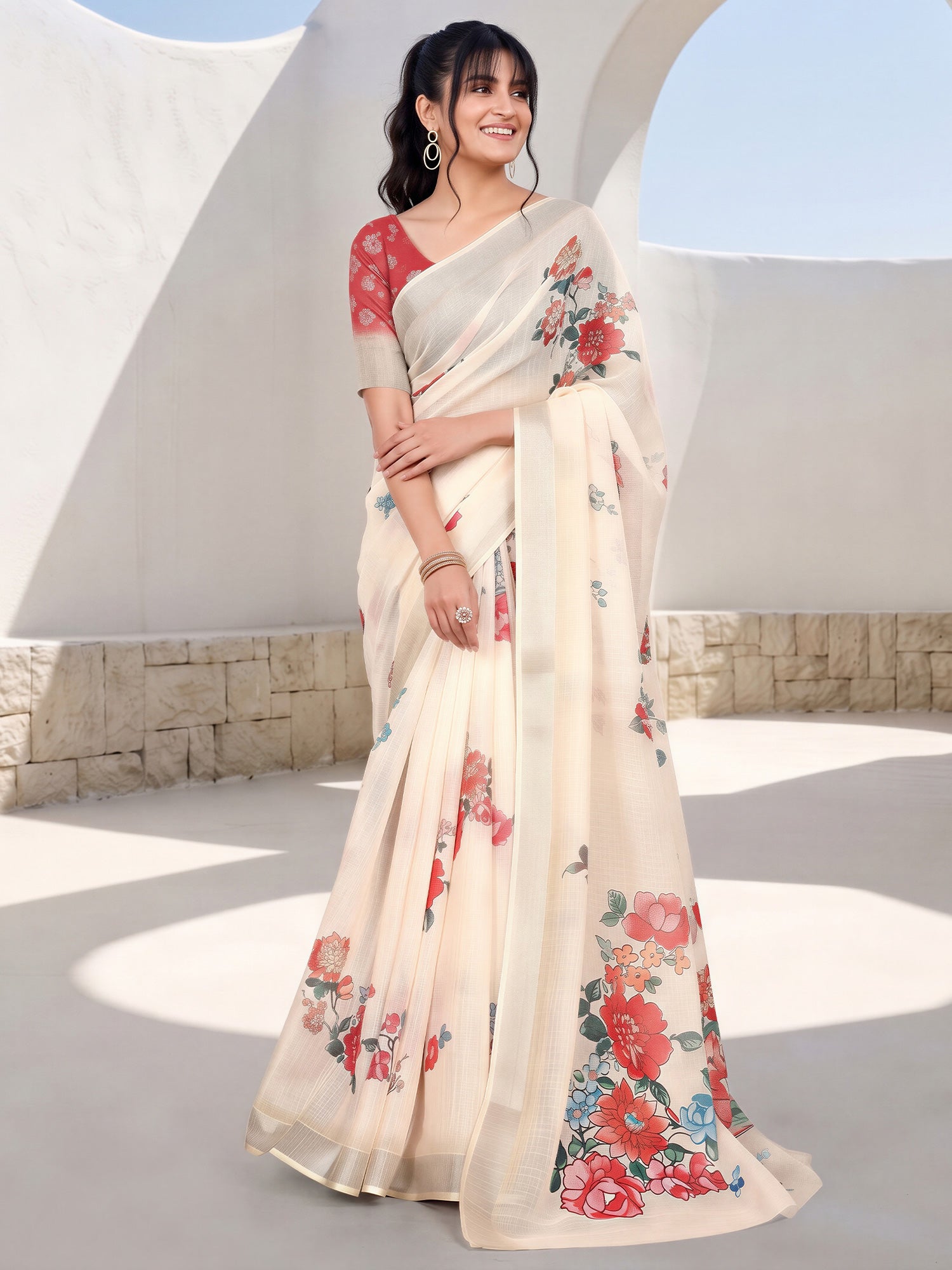 Woman wearing cream cotton linen saree with botanical floral and leaf design and red blouse