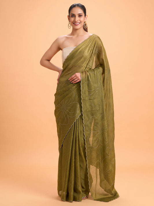 Woman wearing olive satin silk saree with ornamented surface design and white blouse