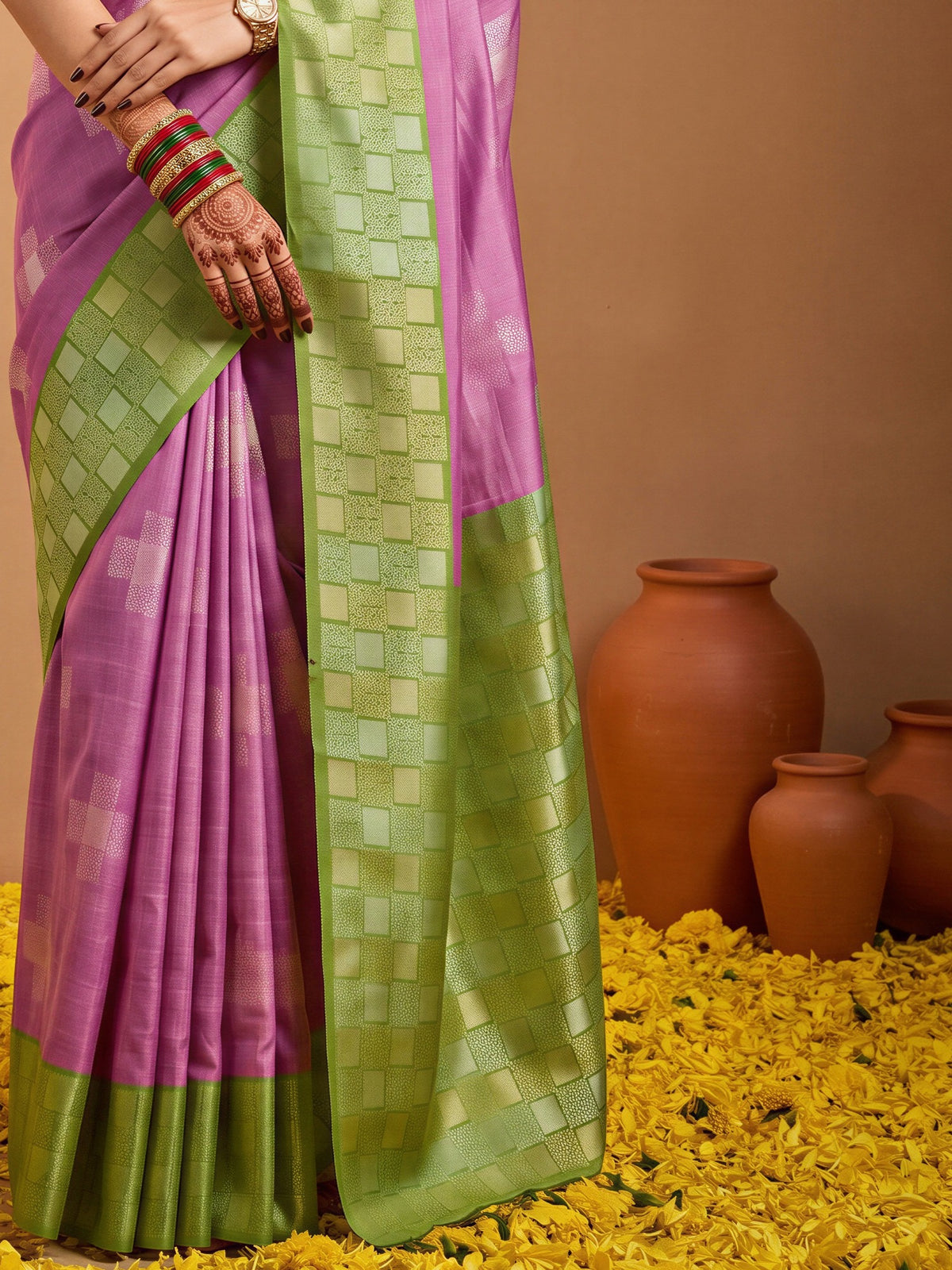 Pallu detail of purple cotton blend saree showing traditional indian motif work and zari border