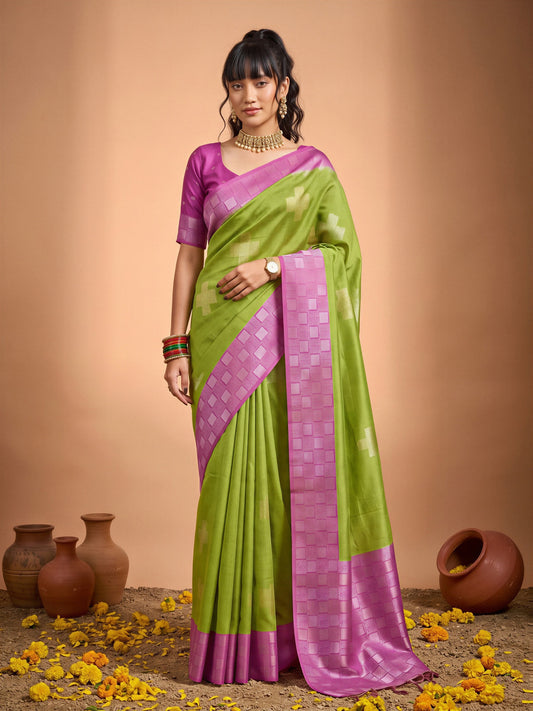 Woman wearing sea green cotton blend saree with traditional indian motif work and pink blouse