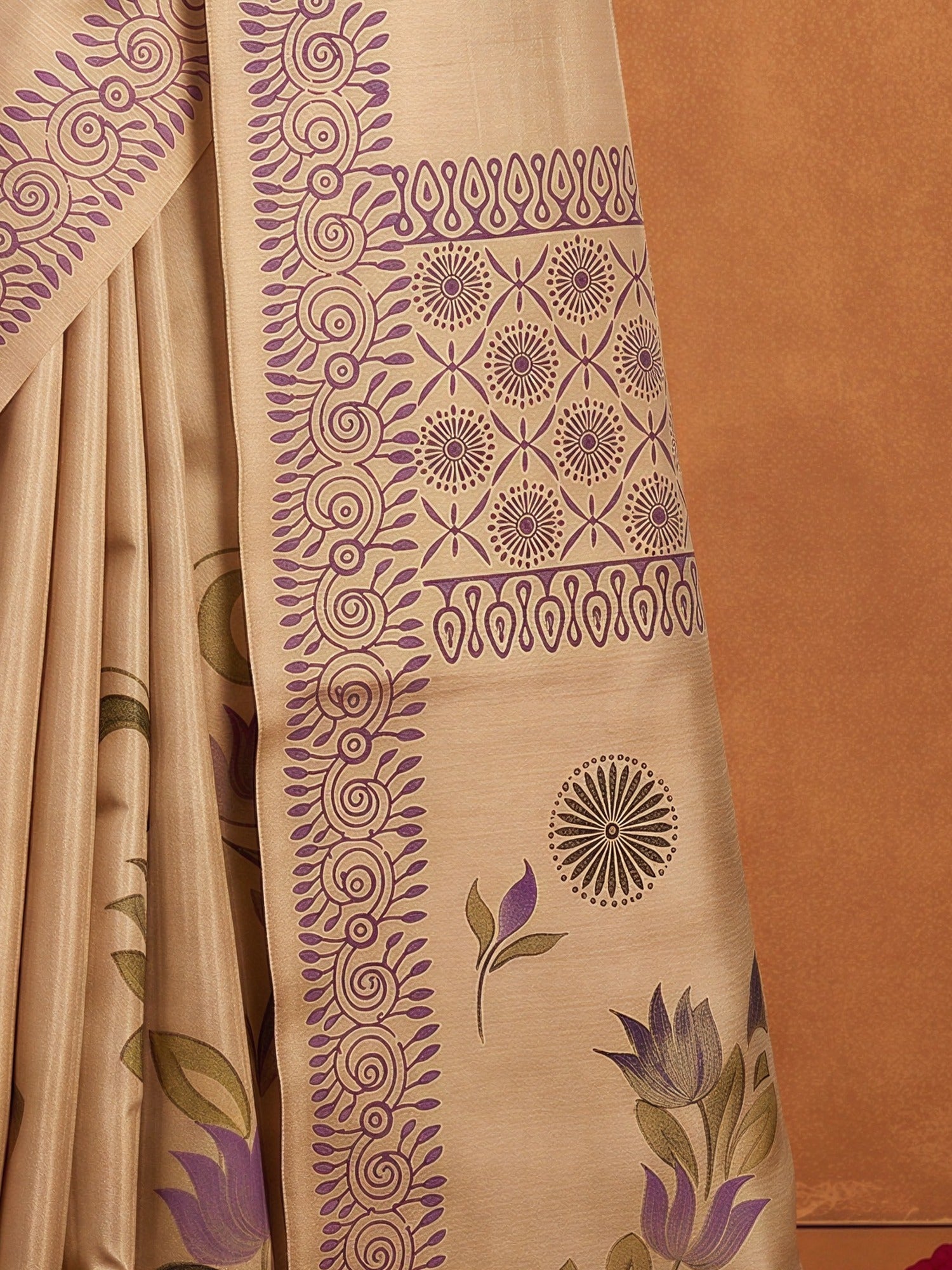 Pallu detail of beige silk blend saree showing hand-painted motif work and printed border