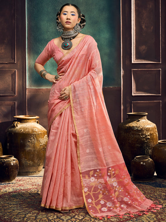 Woman wearing peach muga cotton saree with zari butta (metallic motif) work and peach blouse