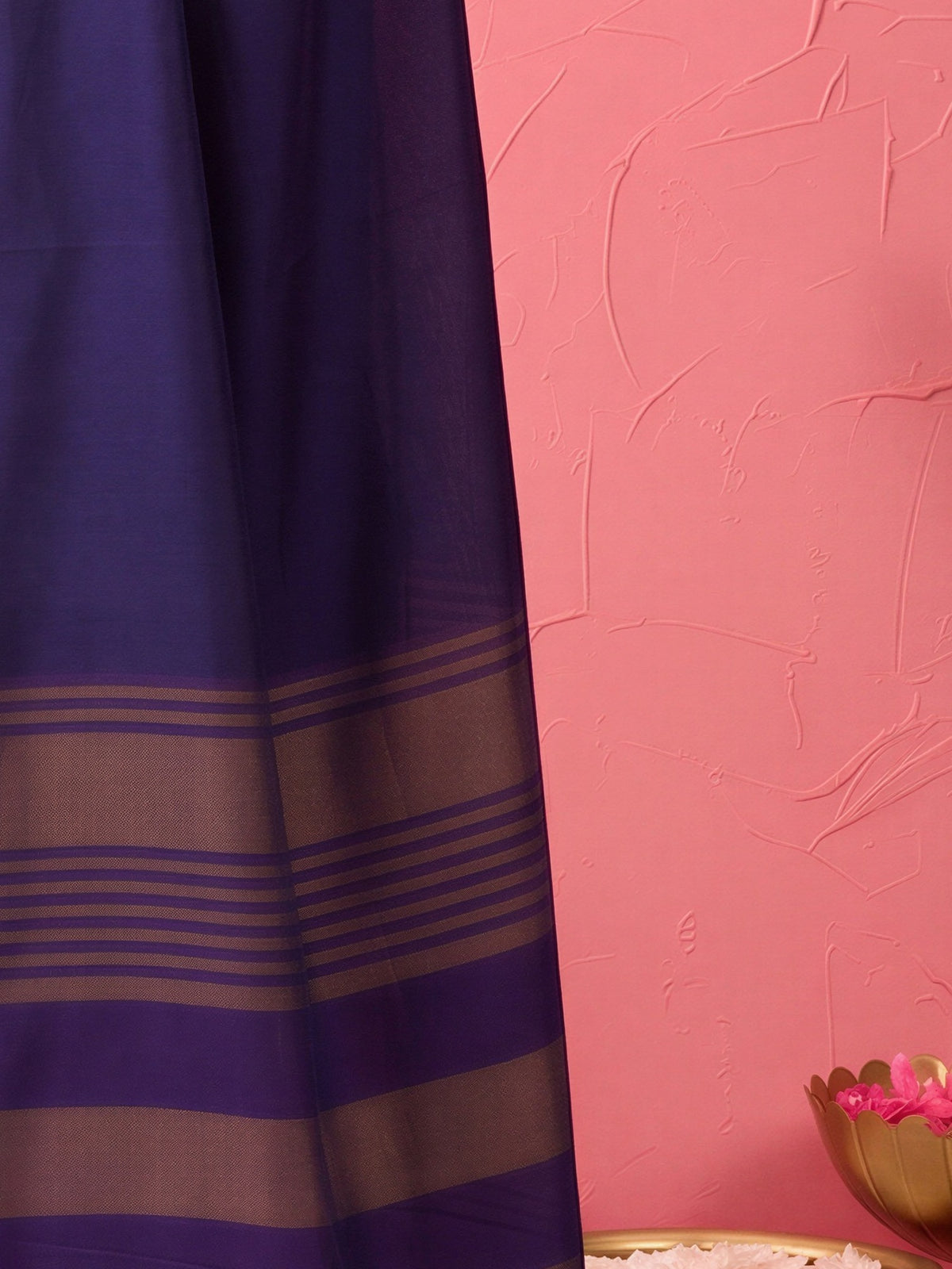 Pallu detail of purple cotton blend saree showing clean solid-tone finish and zari border