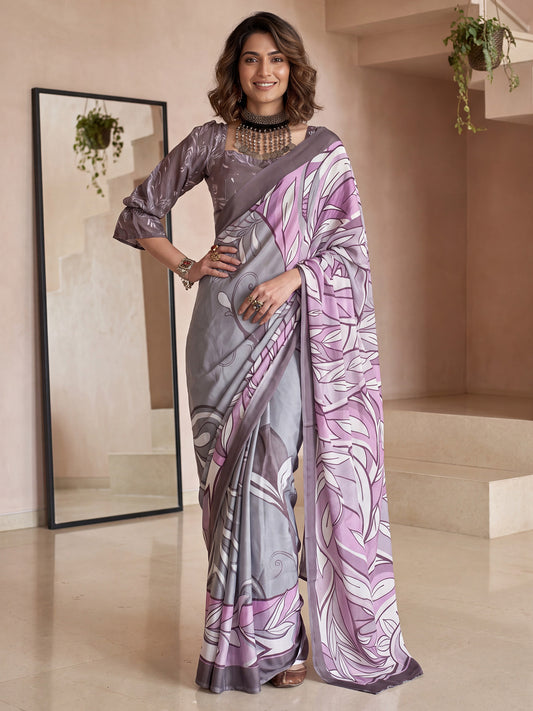 Woman wearing grey crepe saree with abstract contemporary design and mauve blouse