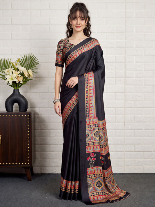 Woman wearing black satin saree with ajrak block-print motif work and black blouse