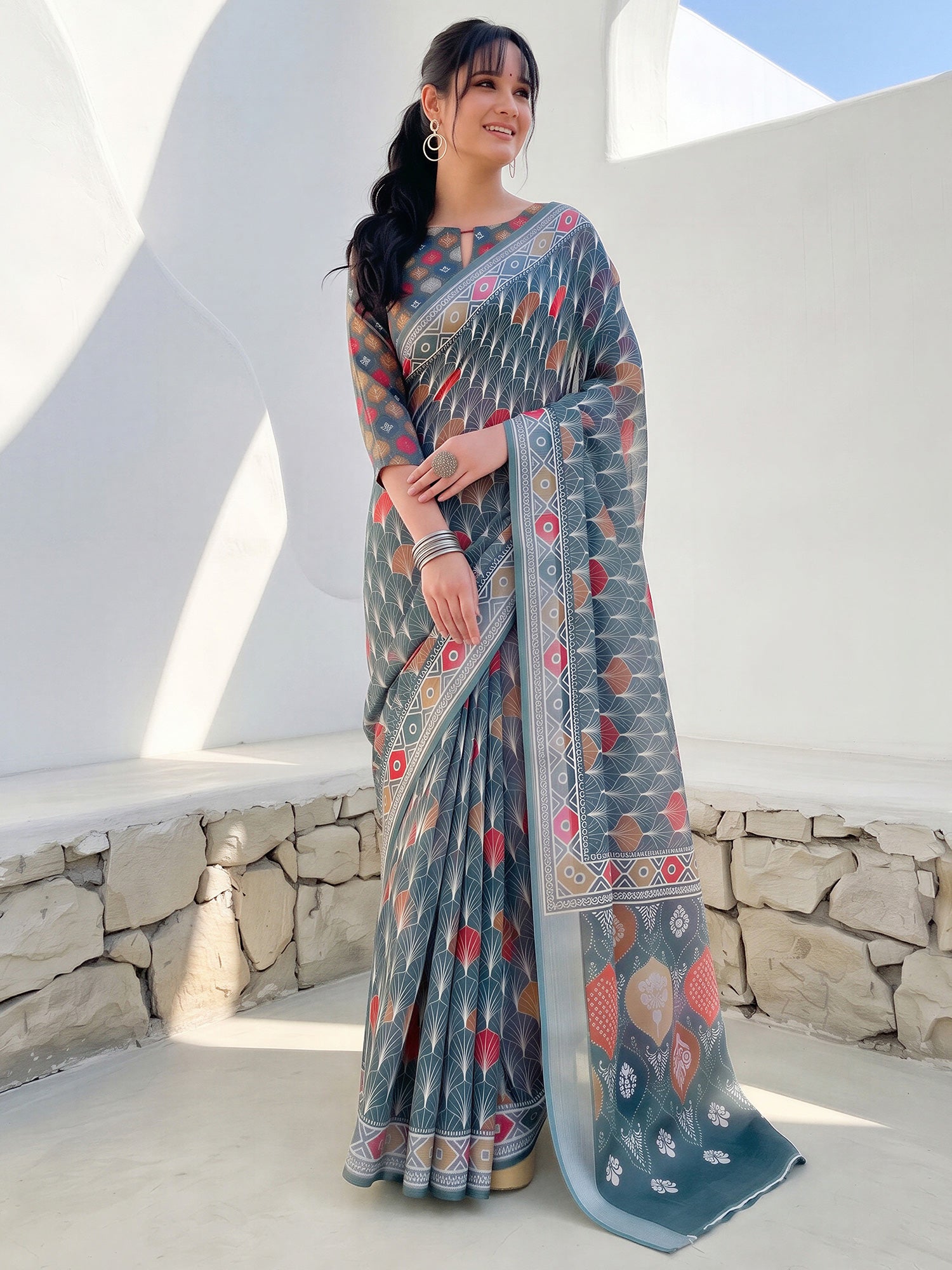 Woman wearing sea green cotton linen saree with traditional indian motif work and sea green blouse